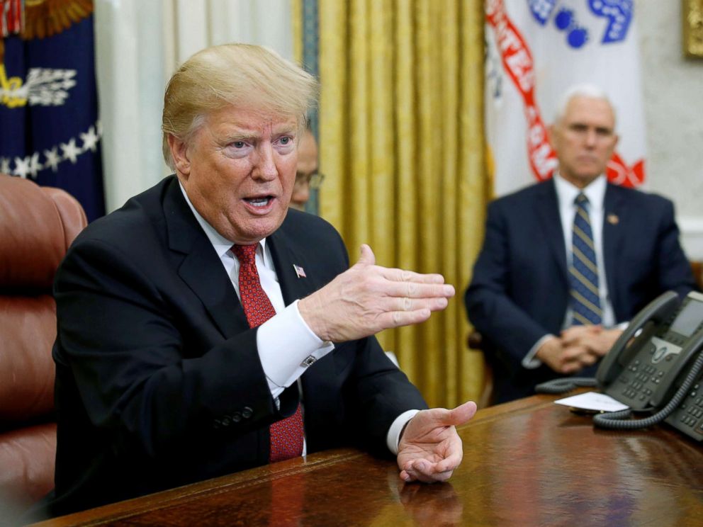   PHOTO: President Donald Trump addresses Chinese Vice Premier Liu He, under the supervision of Vice President Mike Pence, at a meeting in the White House's oval office in Washington, DC January 31, 2019. 