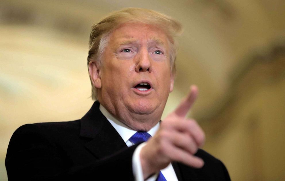 PHOTO: President Donald Trump talks to reporters as he arrives for a closed Senate Republican policy lunch on Capitol Hill in Washington, DC, March 26, 2019.