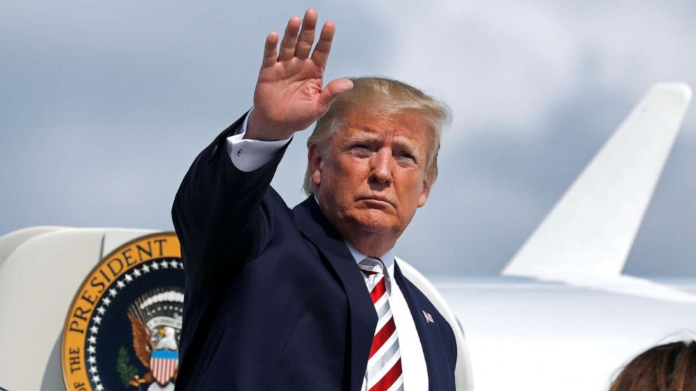 PHOTO: President Donald Trump waves as he boards Air Force One at Morristown municipal airport en route to Washington, Aug. 4, 2019.