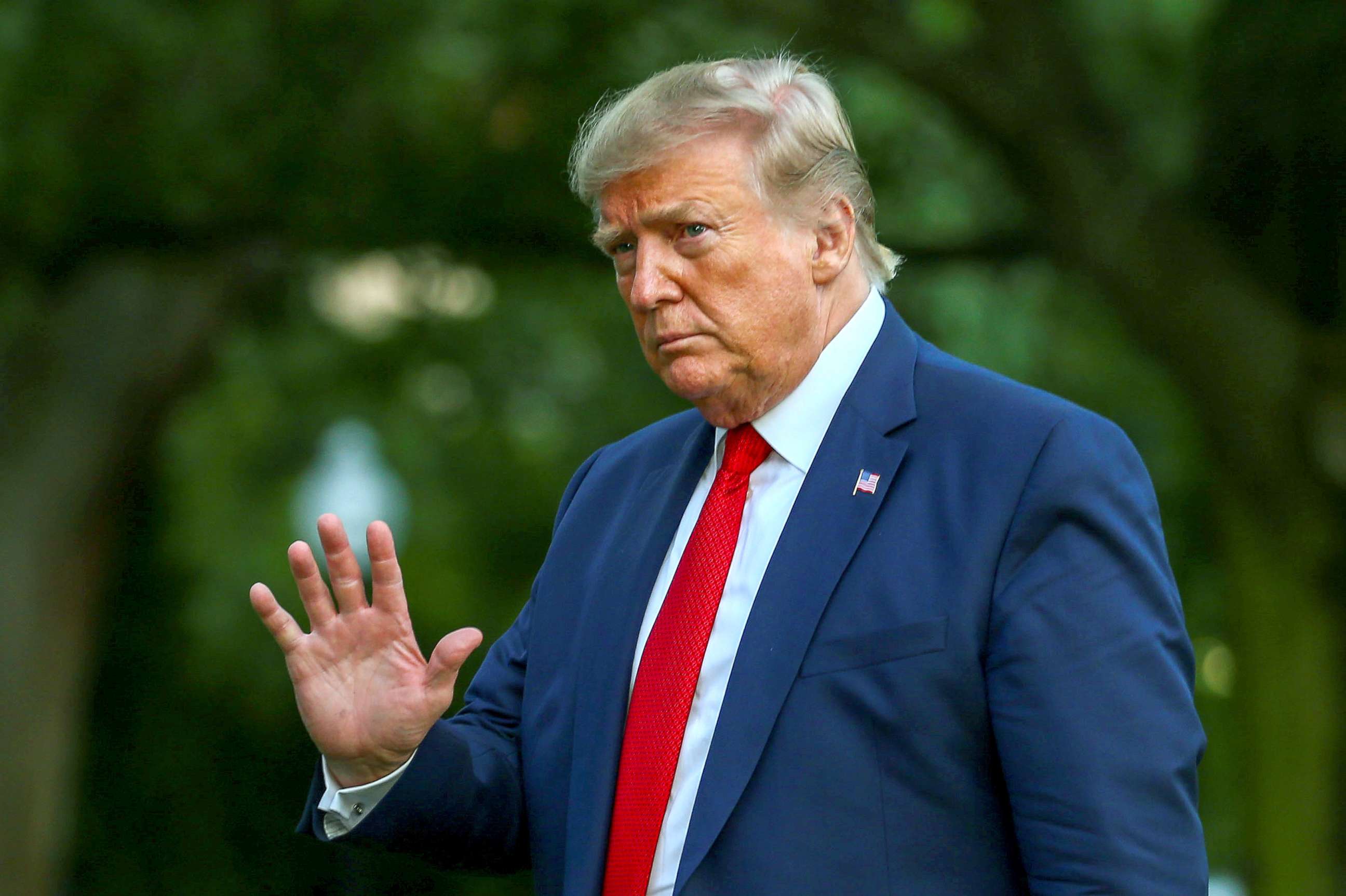 PHOTO: President Donald Trump returns after travelling to the AMVETS convention in Kentucky, at the South Lawn of the White House in Washington, Aug. 21, 2019.