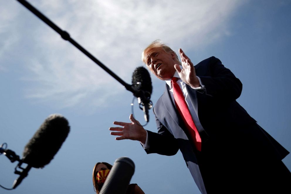 PHOTO: President Donald Trump speaks to reporters as he arrives at Phoenix Sky Harbor International Airport in Phoenix, Oct. 19, 2020.