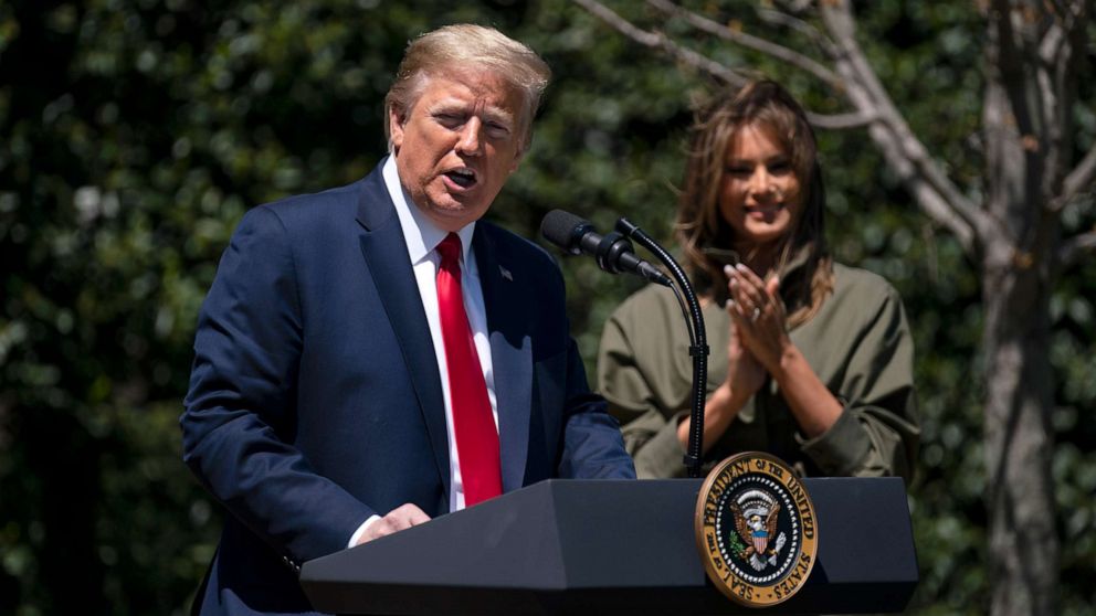 PHOTO: First lady Melania Trump listens as President Donald Trump speaks during a tree planting ceremony to celebrate Earth Day, on the South Lawn of the White House, April 22, 2020, in Washington.