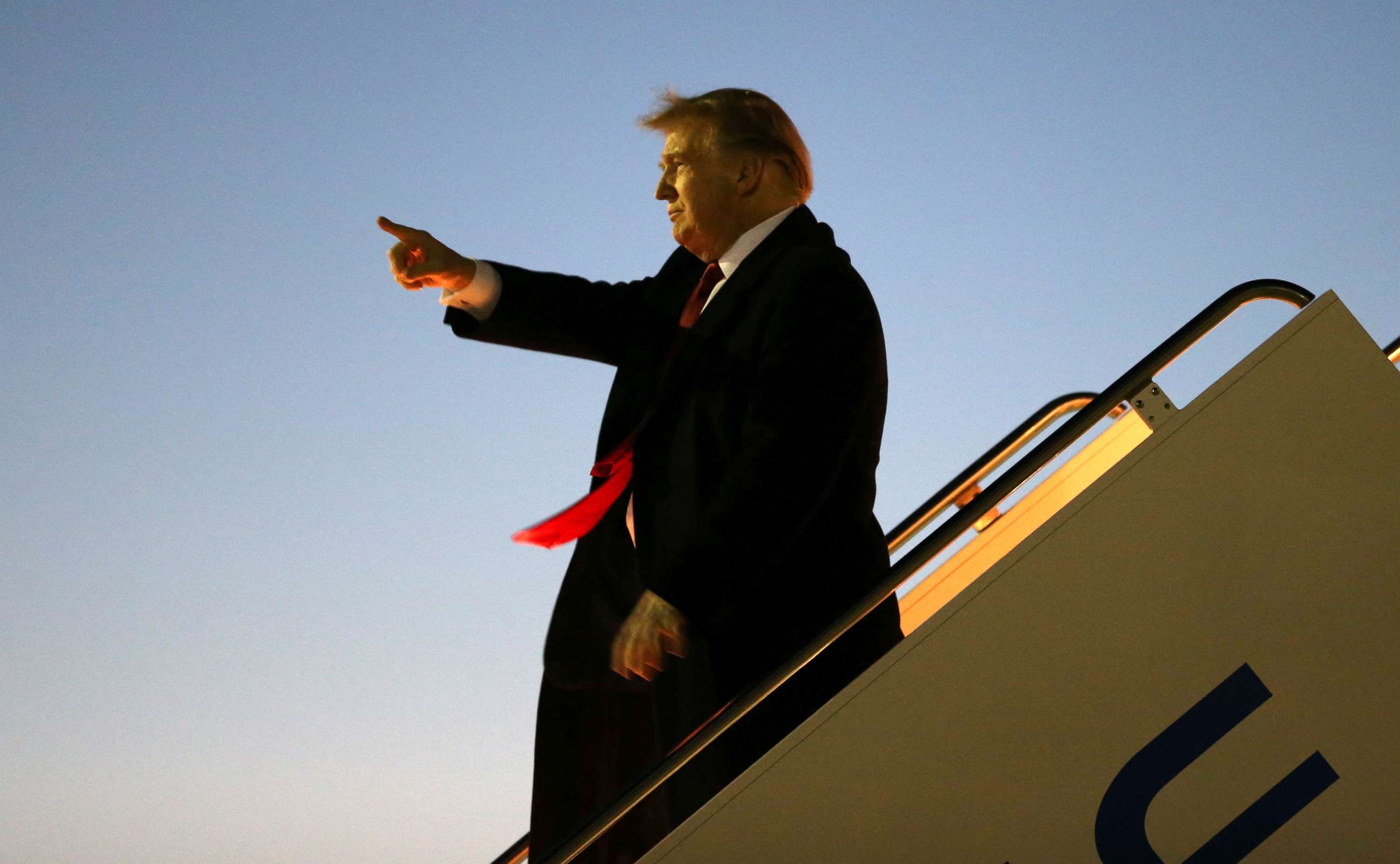 PHOTO: President Donald Trump greets supporters as he disembarks Air Force One after landing at El Paso International Airport in El Paso, Texas, Feb. 11, 2019.