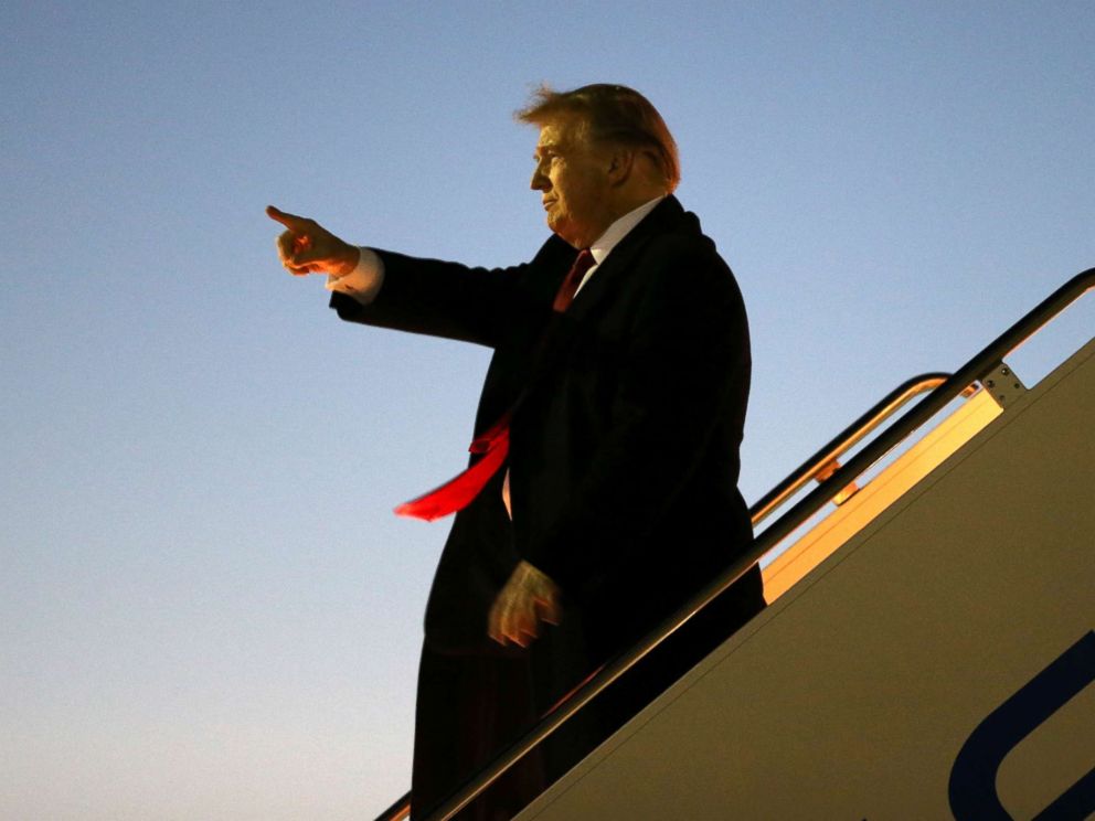 PHOTO: President Donald Trump greets supporters as he disembarks Air Force One after landing at El Paso International Airport in El Paso, Texas, Feb. 11, 2019.