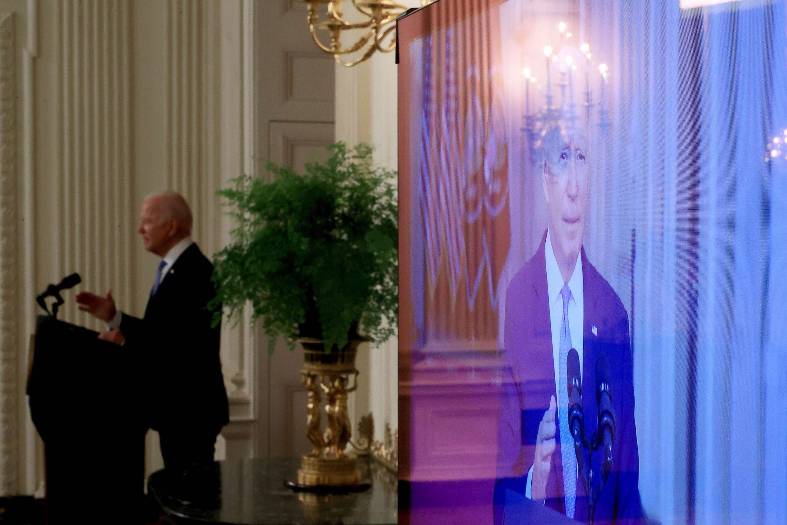 PHOTO: President Joe Biden appears on a television as he delivers remarks on the end of the war in Afghanistan in the State Dining Room at the White House on Aug. 31, 2021. 