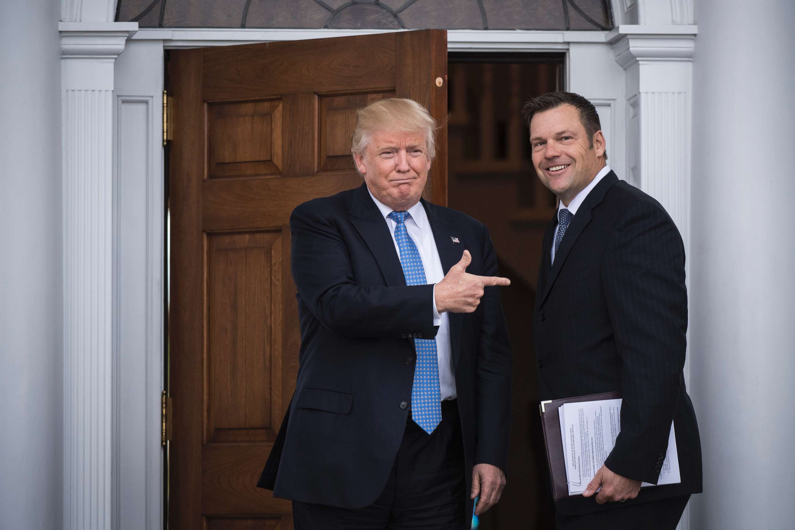 PHOTO: President-elect Donald Trump greets Kansas Secretary of State, Kris Kobach, at the clubhouse at Trump National Golf Club Bedminster in Bedminster Township, N.J., Nov. 20, 2016.