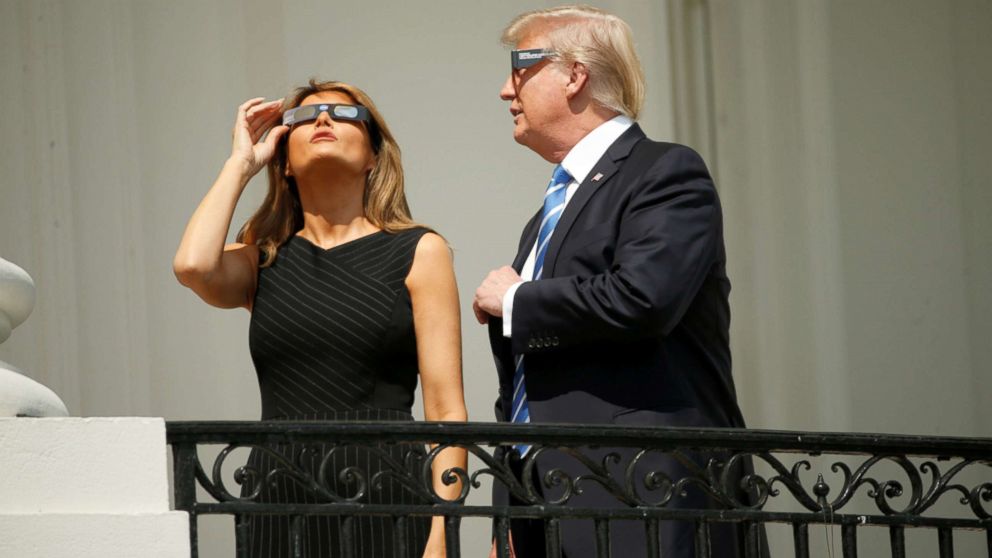 PHOTO: President Donald Trump watches the solar eclipse with first Lady Melania Trump from the Truman Balcony at the White House in Washington, Aug. 21, 2017.