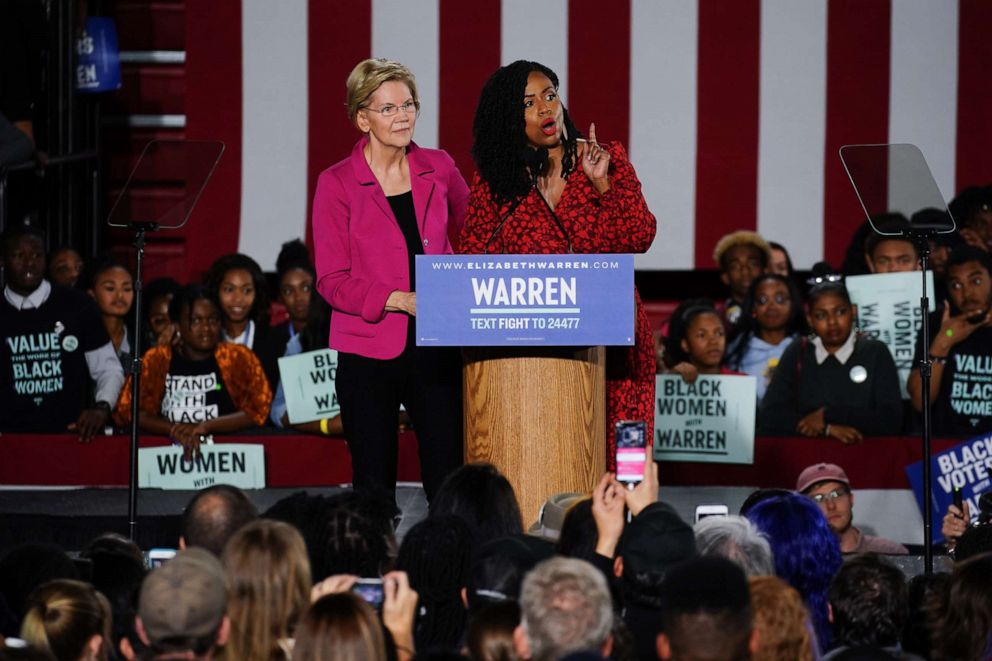 PHOTO: Democratic presidential candidate Sen. Elizabeth Warren, D-Mass., stands with Rep. Ayanna Pressley, D-Mass., as she addresses a group of protesters during a campaign event at Clark Atlanta University on Nov. 21, 2019, in Atlanta.