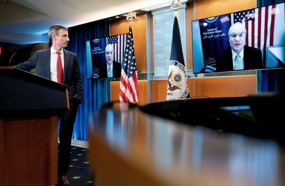 PHOTO: State Department spokesman Ned Price, left, listens as  U.S. special envoy for Yemen Timothy Lenderking speaks via teleconference during a news conference at the State Department in Washington, D.C. on Feb. 16, 2021.