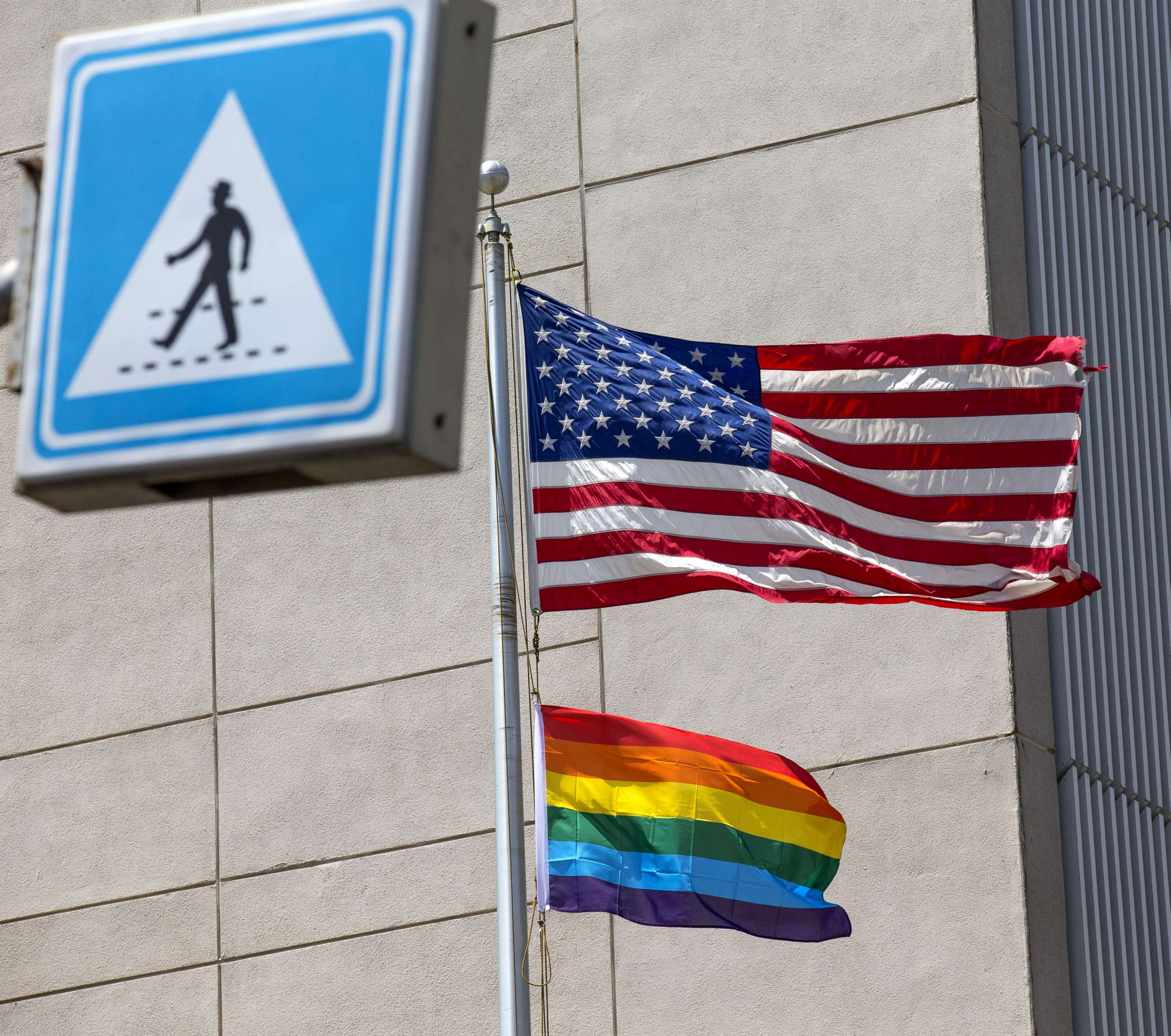 PHOTO: A gay pride flag is raised next to the US flag is at the former US embassy in Tel Aviv, June 13, 2014, in this file photo.