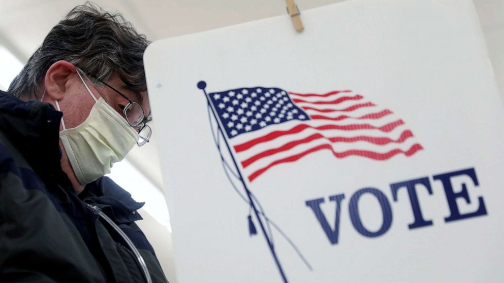 PHOTO: Voter Fred Hoffman fills out his ballot during the primary election in Ottawa, Ill., March 17, 2020.