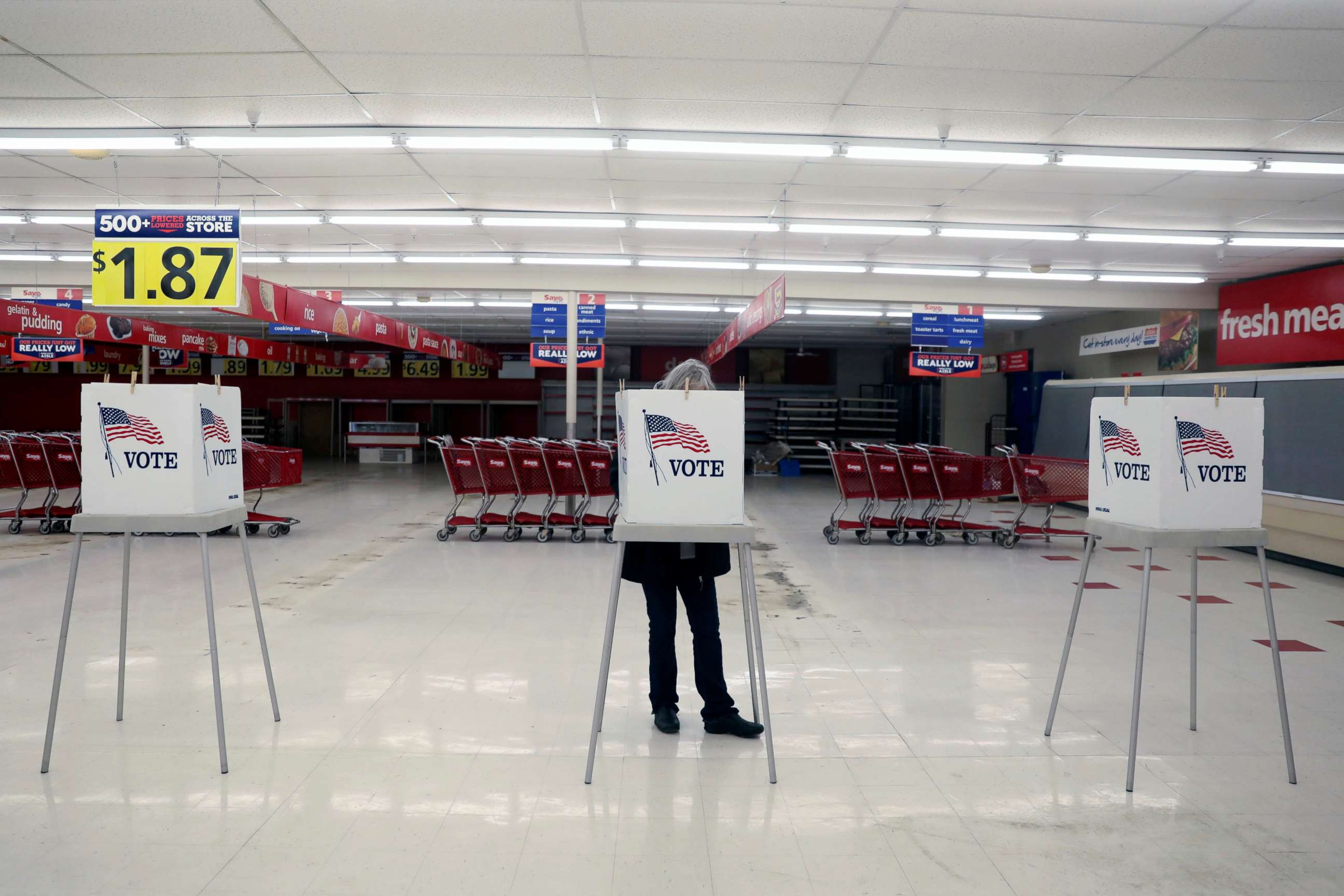 PHOTO: A voter fills out a ballot during the primary election in Ottawa, Ill., March 17, 2020. The polling station was relocated from a nearby nursing home to a former supermarket due to concerns over the outbreak of coronavirus.