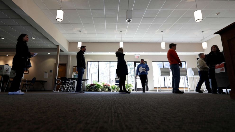 PHOTO: Evanston residents line up for voting at Trinity Lutheran Church in Evanston, Ill., March 17, 2020.