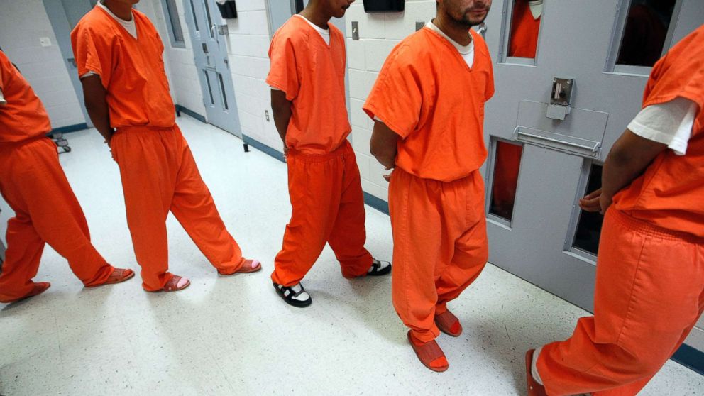PHOTO: New federal inmates prepare to undergo health screenings while being processed at the Val Verde Correctional Facility in Del Rio, Texas.