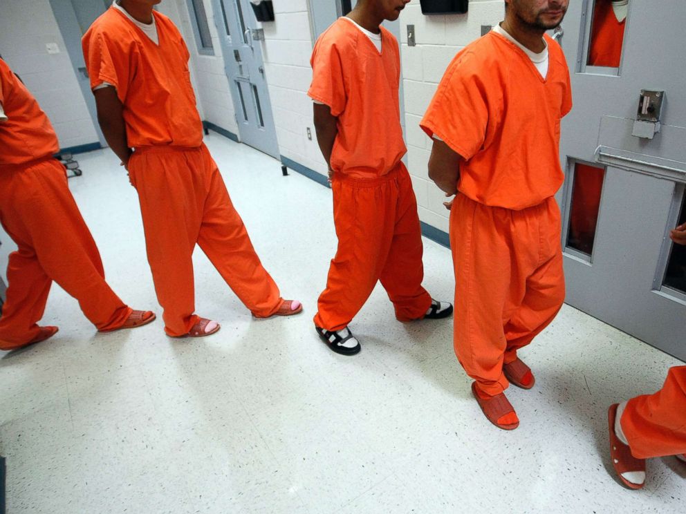 New federal inmates prepare to undergo health screenings while being proces...