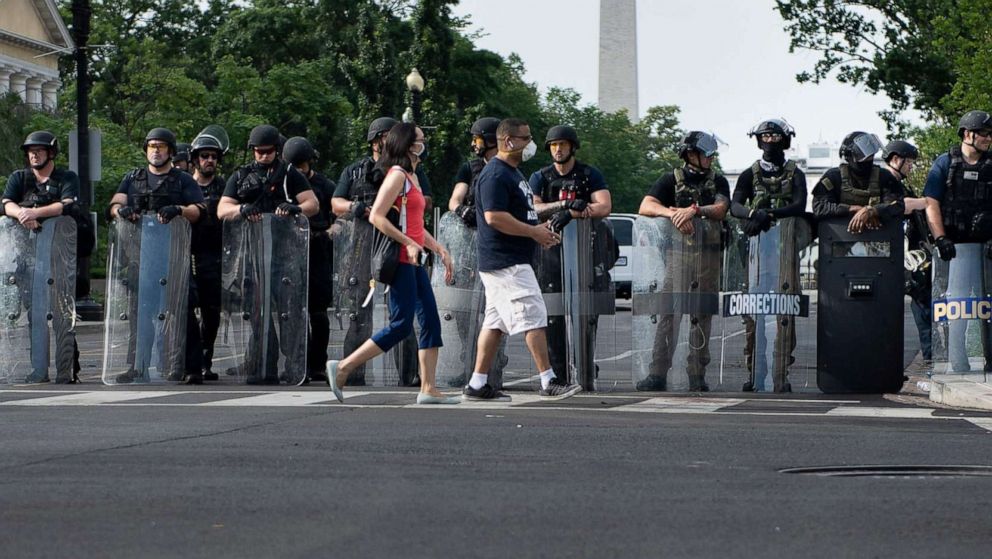 PHOTO: Members of the Federal Bureau of Prisons and other law enforcement block 16th Street, NW near the White House as protests over the death of George Floyd continue on June 3, 2020, in Washington.