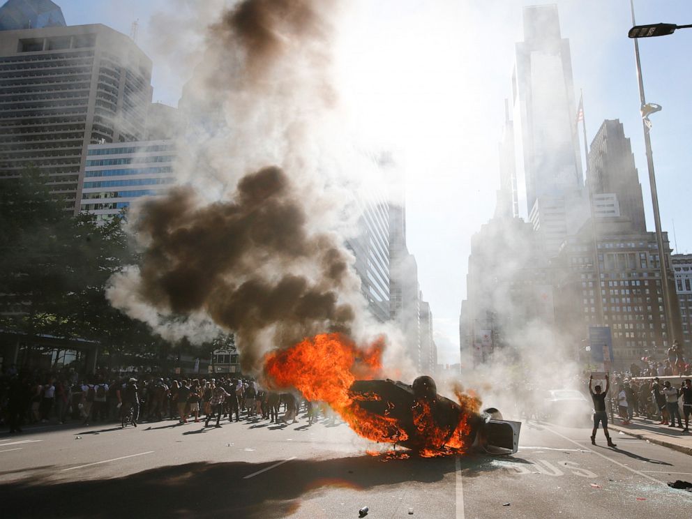 PHOTO: Smoke rises from a fire on a police cruiser in Center City during the Justice for George Floyd Philadelphia Protest on Saturday, May 30, 2020, in Philadelphia.
