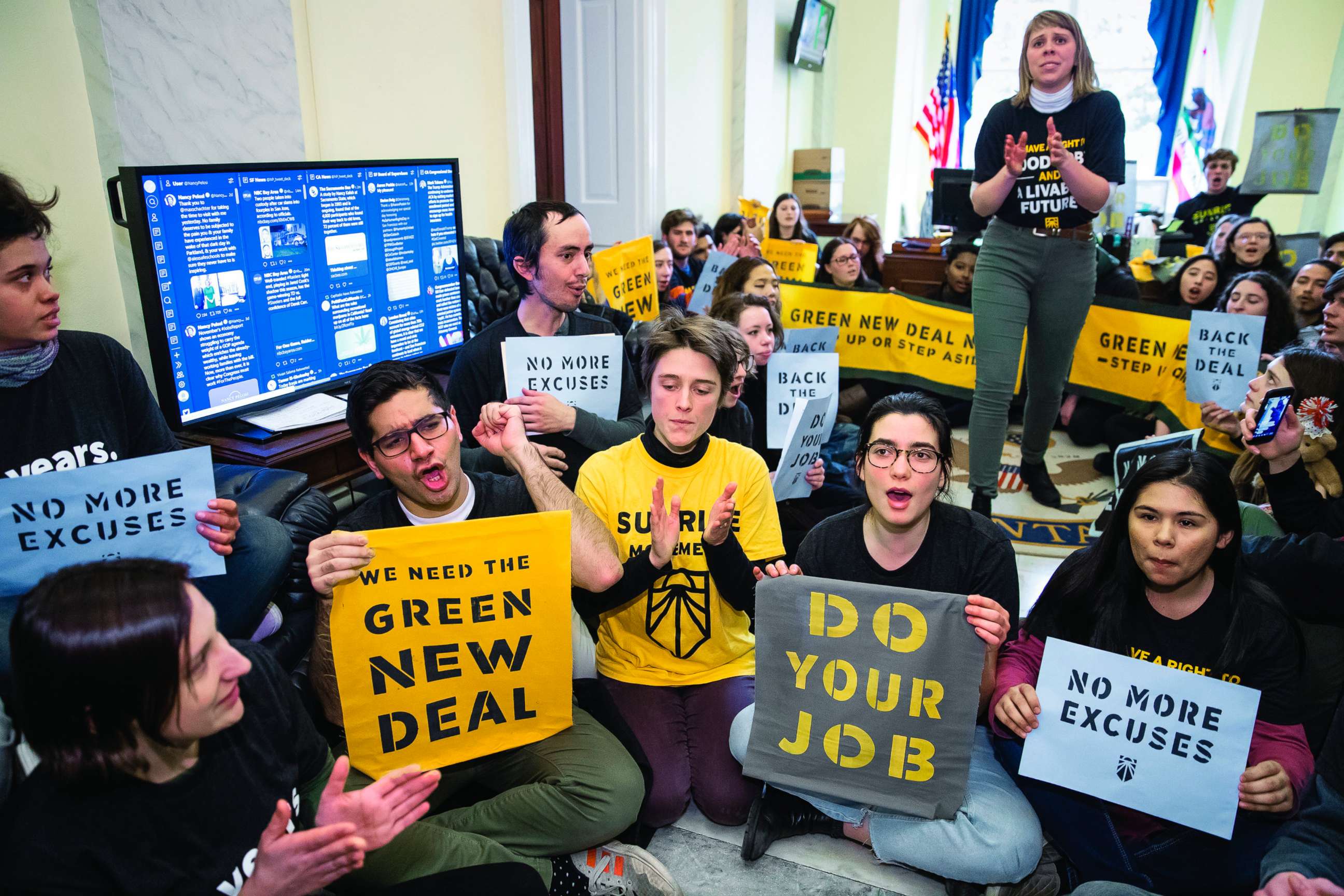 PHOTO: Environmental activists occupy the office of House Democratic Leader Nancy Pelosi of California, as they try to pressure Democratic support for a sweeping agenda to fight climate change, on Capitol Hill, Dec. 10, 2018. 