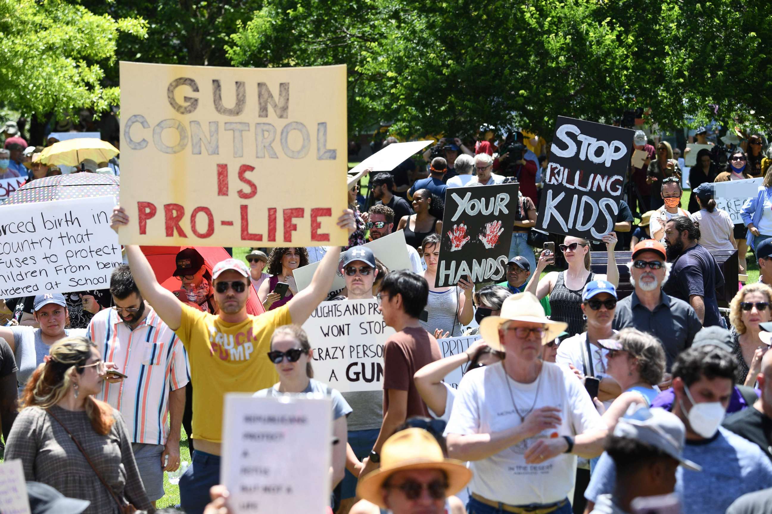 PHOTO: Gun rights activists and supporters protest outside the National Rifle Association Annual Meeting at the George R. Brown Convention Center, on May 27, 2022, in Houston.