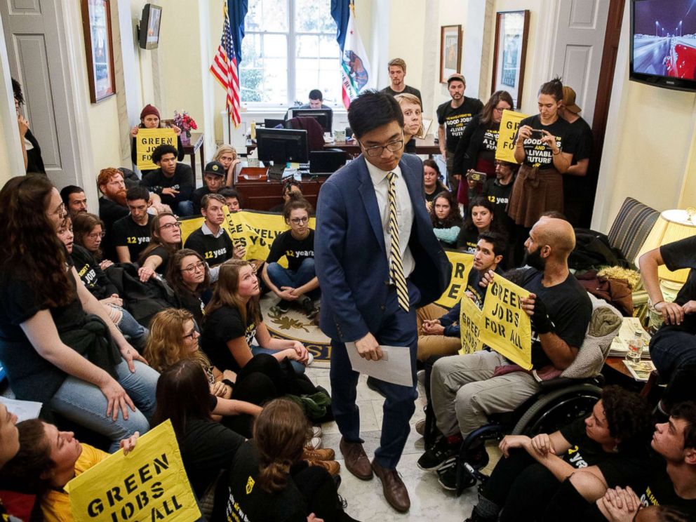 PHOTO: Activists from Sunrise Movement and Justice Democrats sit outside House Minority Leader Nancy Pelosis office on Capitol Hill in Washington, Nov. 13, 2018.