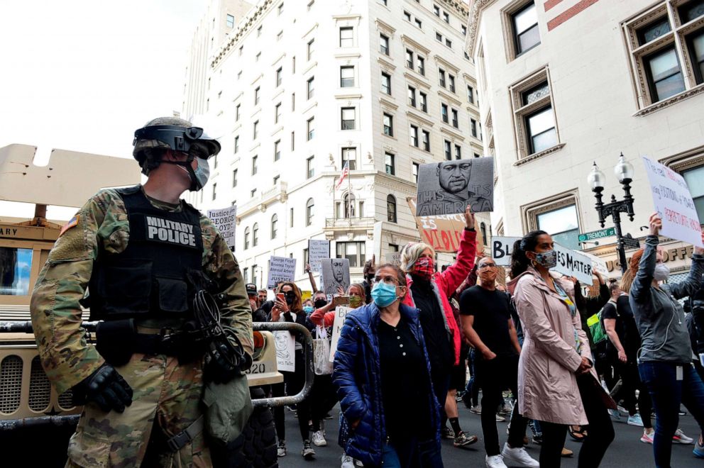 PHOTO: A National Guard Soldier looks on as people march from Boston City Hall to just outside the Boston Police Station to call for Police Department reform Boston, Massachusetts on June 7, 2020.