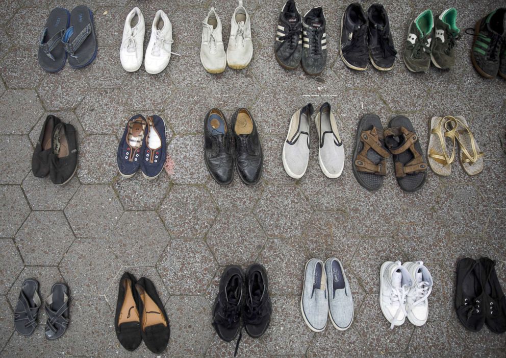 PHOTO: Activists leave their shoes on the ground to represent refugees during a rally to support immigrants and to mark World Refugee Day, June 20, 2018, in New York City.