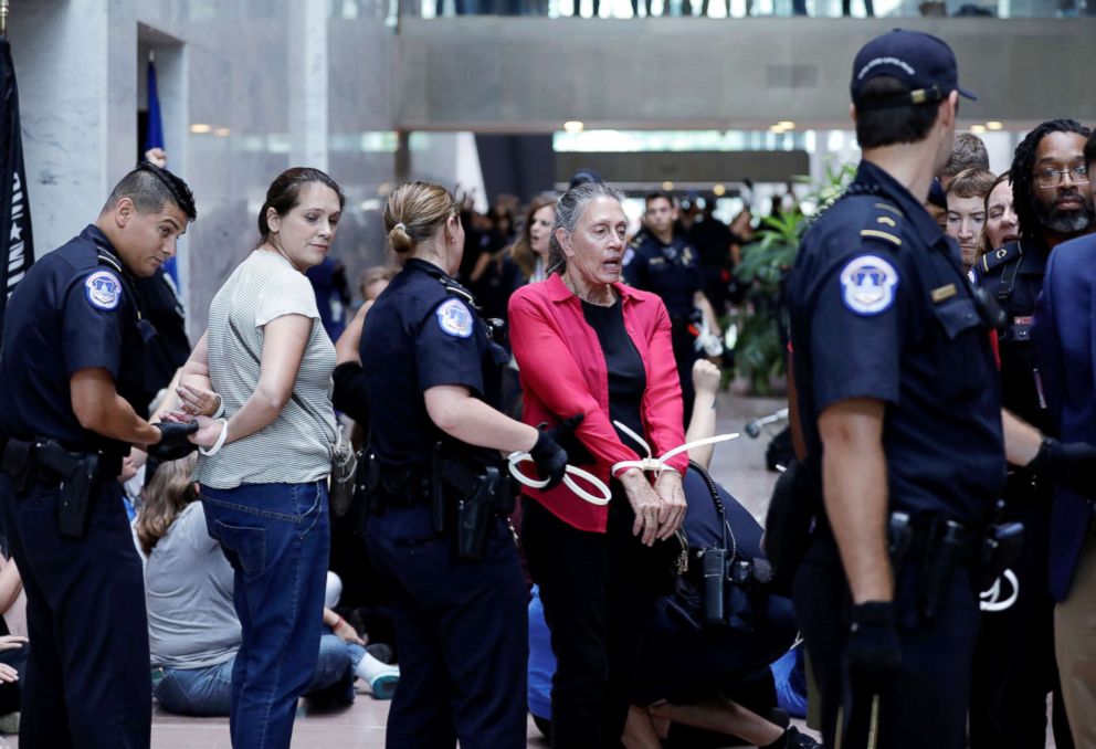 PHOTO: Protesters are arrested during a demonstration in opposition to President Donald Trump's Supreme Court nominee Brett Kavanaugh on Capitol Hill in Washington, Sept. 20, 2018.