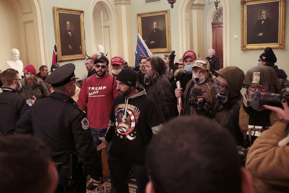 PHOTO: Protesters interact with Capitol Police inside the U.S. Capitol Building on Jan. 6, 2021, in Washington, D.C., after they breached the building while a joint session to certify the electoral college votes was taking place.