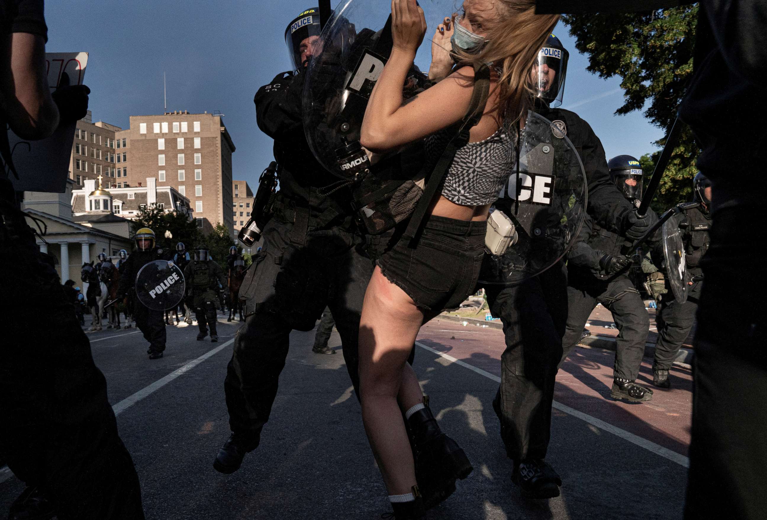 PHOTO: Riot police rush demonstrators as they clear Lafayette Park and the area around it across from the White House for President Donald Trump to be able to walk through for a photo opportunity, June 1, 2020.