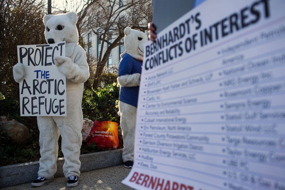 PHOTO: Demonstrators gather outside of the Dirksen Senate Office Building on Capitol Hill ahead of a confirmation hearing for David Bernhardt, President Donald Trump's nominee to be Secretary of the Interior, March 28, 2019, in Washington, D.C.