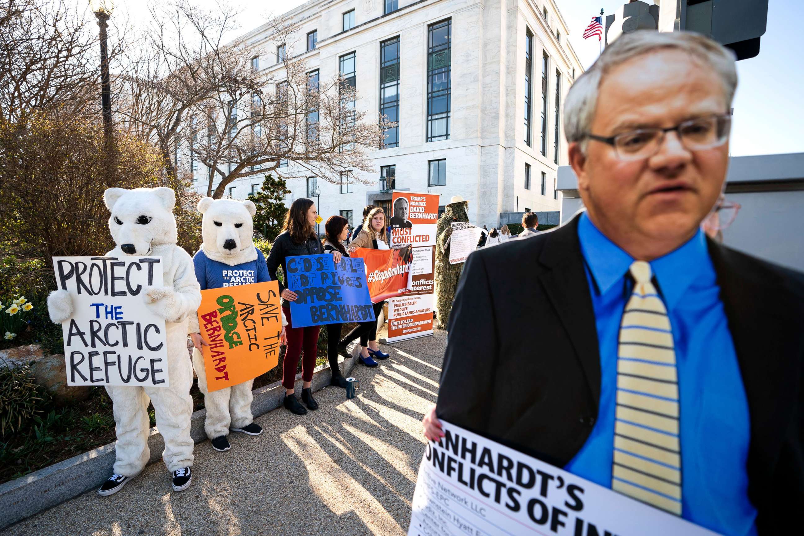 PHOTO: Activists with the consumer rights advocacy group 'Public Citizen' protest the nomination of David Bernhardt to head the Department of the Interior, outside the Dirksen Senate Office Building in Washington, D.C., March 28, 2019.