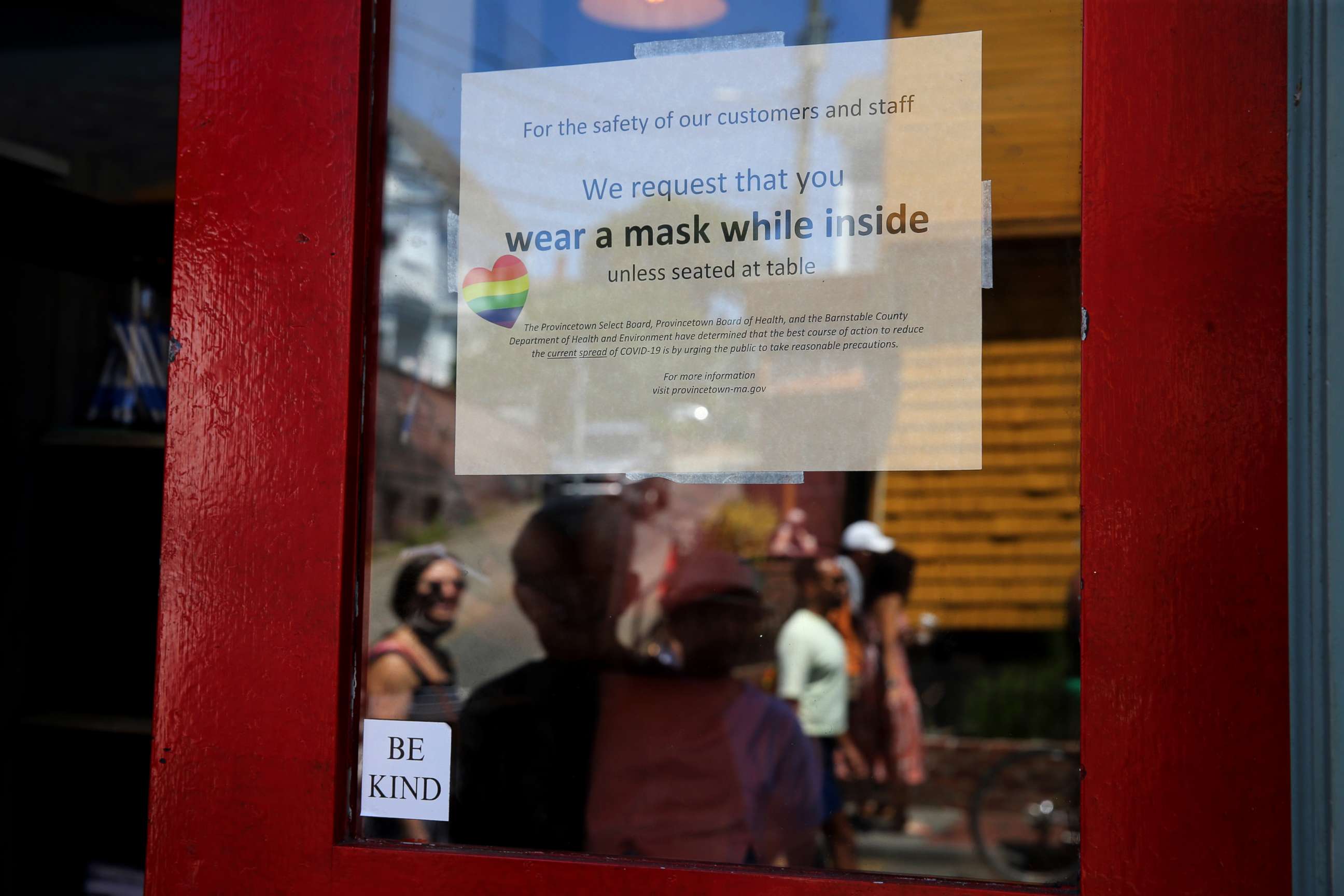 PHOTO: A sign at the Heaven Cafe encourages customers to wear masks until seated, in Provincetown, MA., on July 24, 2021.