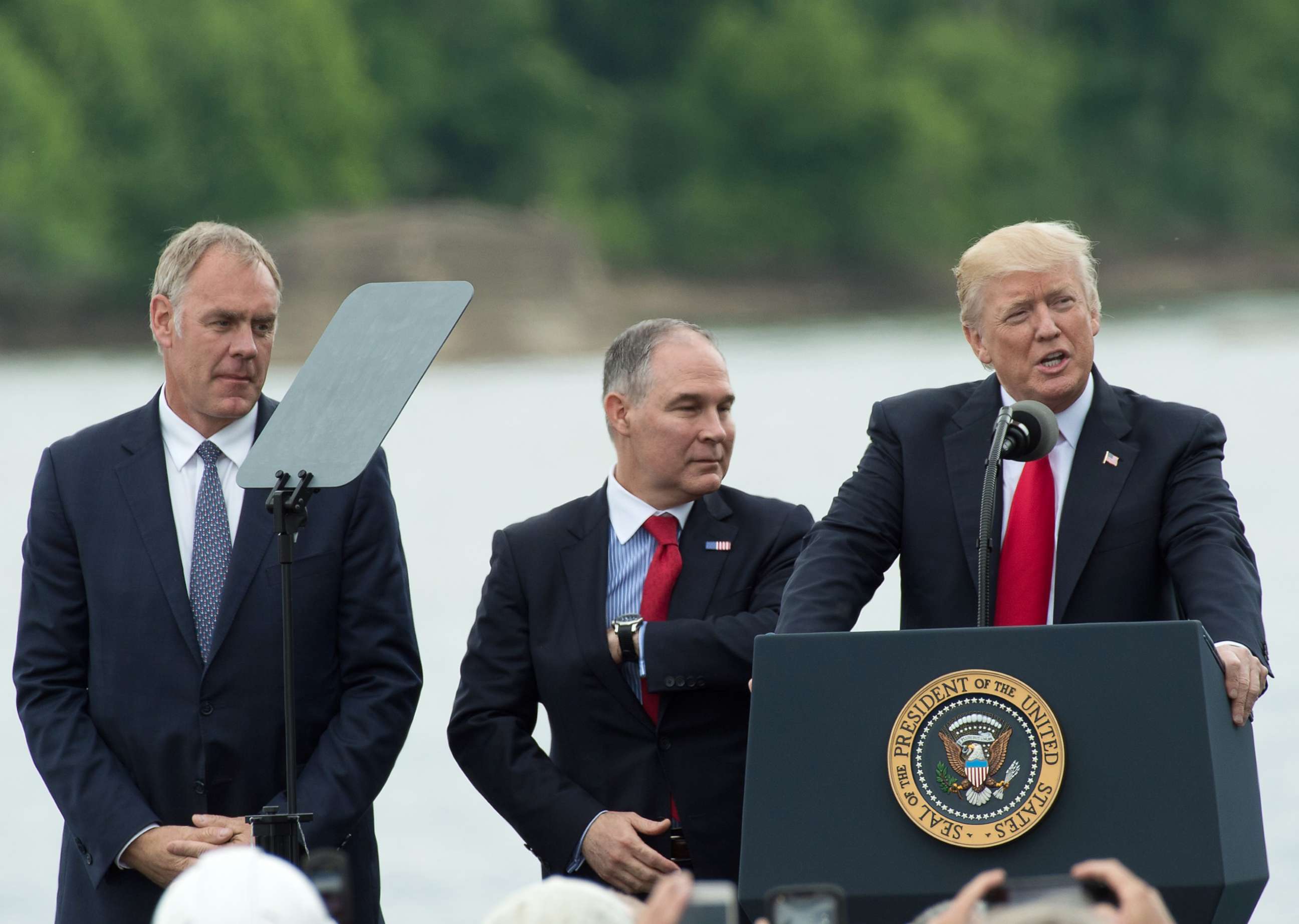PHOTO: President Donald Trump, speaks while Secretary of the Interior Ryan Zinke, left, and EPA Administrator Scott Pruitt, stand at his side in Cincinnati, Ohio, June 7, 2017.