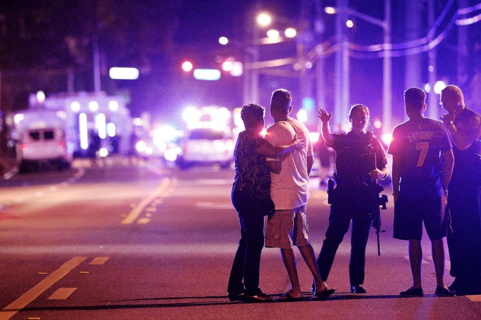 PHOTO: An Orlando police officer keeps family members away from a shootout at the Pulse Nightclub in Orlando, Florida, which claimed the lives of 49 people on June 12, 2016.