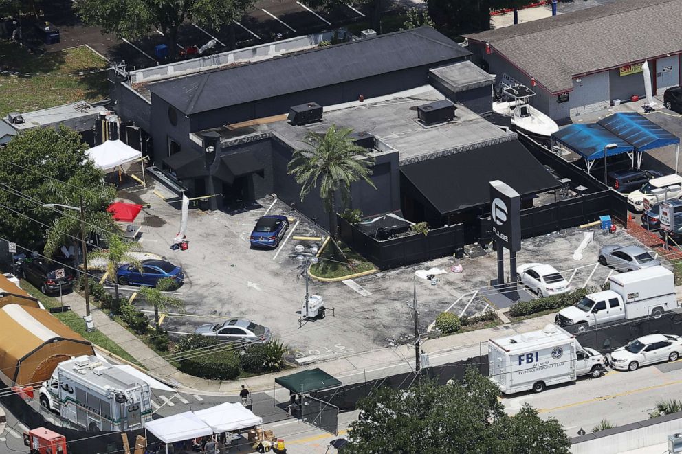 PHOTO: Law enforcement officials investigate at the Pulse nightclub where a gunman killed 49 people and wounded 58 others, on June 13, 2016, in Orlando, Fla.