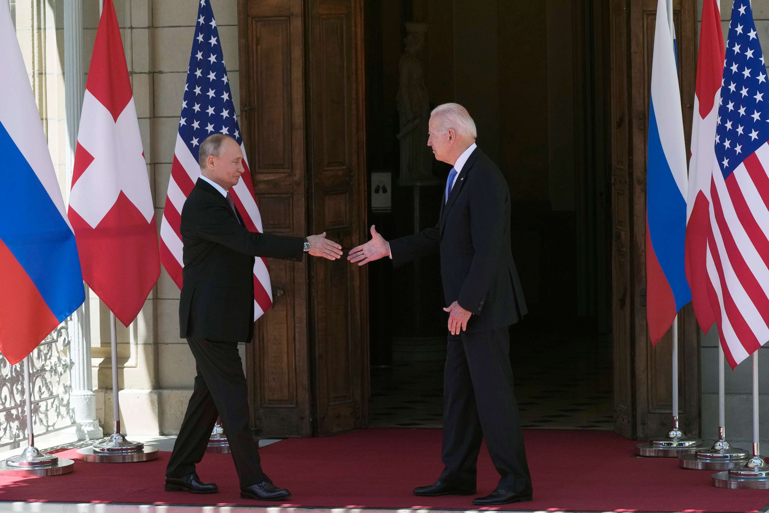 PHOTO: Russian President Vladimir Putin, left, and U.S President Joe Biden shake hands during their meeting at the 'Villa la Grange' in Geneva, Switzerland in Geneva, June 16, 2021.