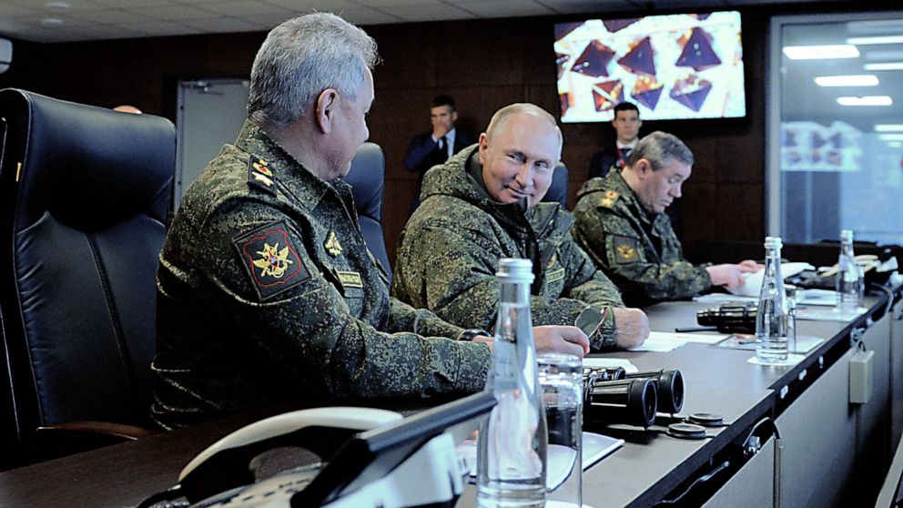 PHOTO: Russian President Vladimir Putin, accompanied by Defense Minister Sergei Shoigu (L) and Valery Gerasimov, the chief of the Russian General Staff, oversees the 'Vostok-2022' military exercises outside Ussuriysk, Russia, Sept.  6, 2022.