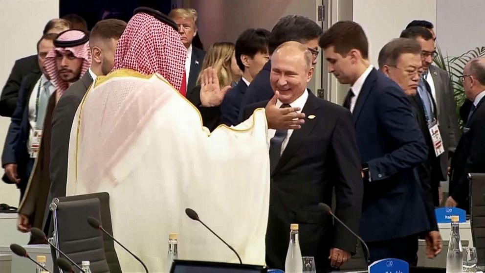 PHOTO: Russia's President Vladimir Putin, center, and Saudi Arabia's Crown Prince Mohammed bin Salman greet each other at the G20 Leaders' Summit in Buenos Aires, Nov. 30, 2018, as President Donald Trump enter the room.