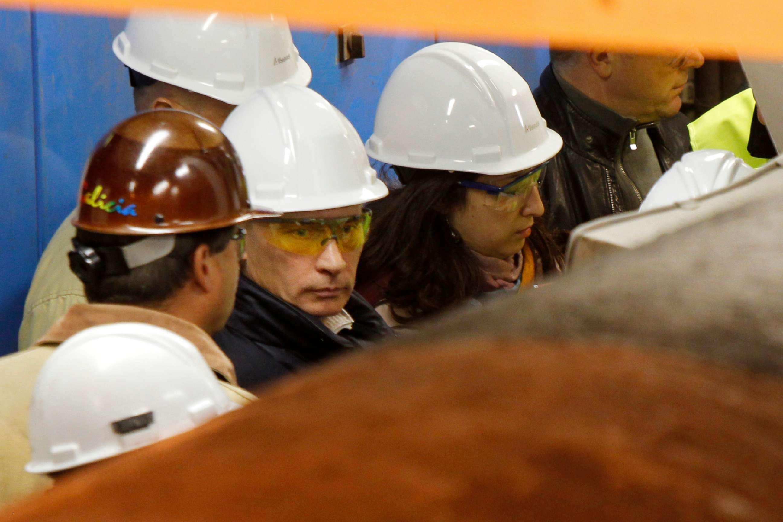 PHOTO: Then-Russian Prime minister Vladimir Putin, center, looks at a pipe as he visits the Solitaire ship in Finnish gulf 125 miles west of St. Petersburg, on Sept. 20, 2010.