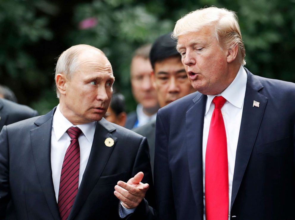 PHOTO: President Donald Trump and Russia's President Vladimir Putin talk as they make their way to take the "family photo" during the Asia-Pacific Economic Cooperation (APEC) leaders' summit in the central Vietnamese city of Danang on November 11, 2017.