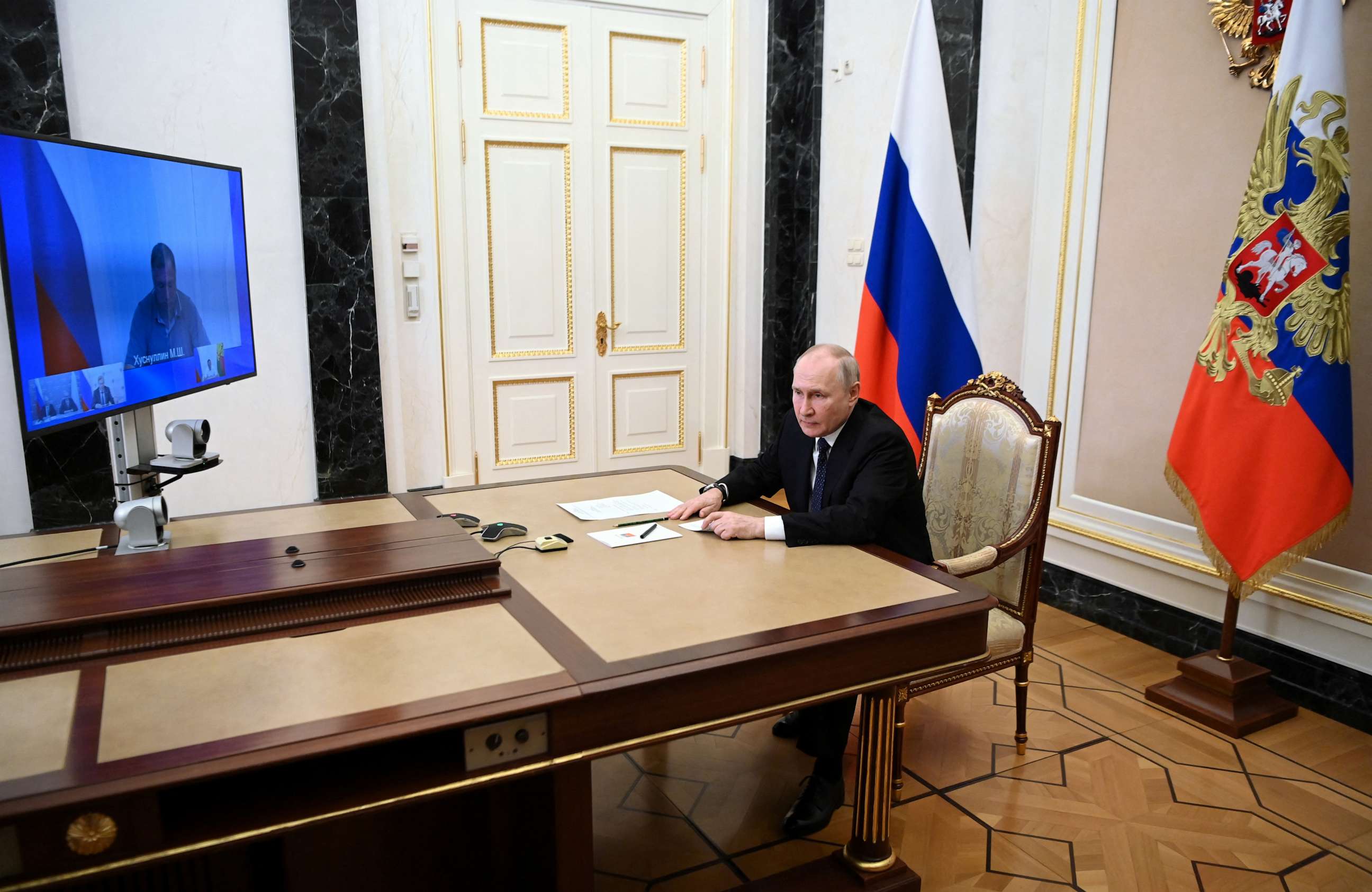 PHOTO: Russian President Vladimir Putin attends a televised meeting with officials to assess the consequences of an attack on the Crimean Bridge in Moscow, July 17, 2023.