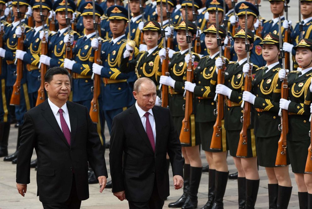 PHOTO: In this June 8, 2018, file photo, Russia's President Vladimir Putin reviews a military honor guard with Chinese President Xi Jinping during a welcoming ceremony outside the Great Hall of the People in Beijing.