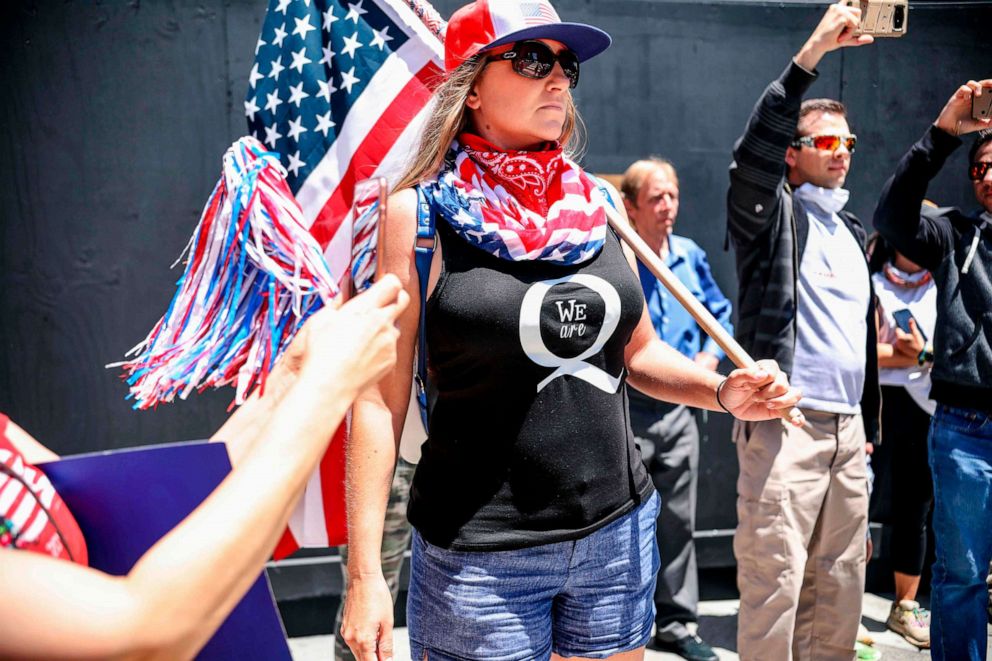 PHOTO:QAnon demonstrators protest during a rally to re-open California and against Stay-At-Home directives, May 1, 2020, in San Diego, Calif.