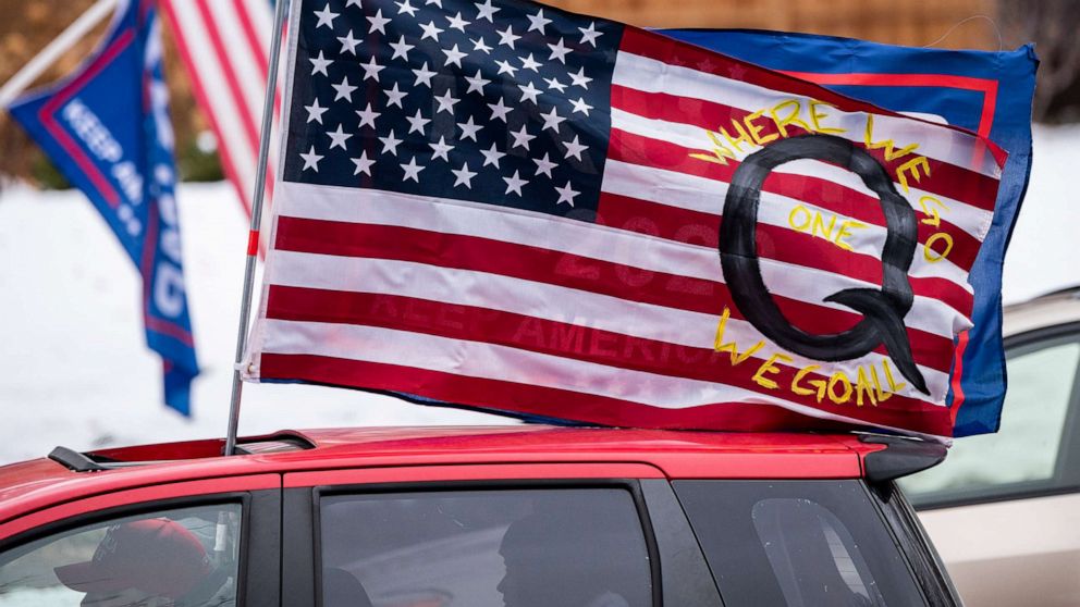 qanon-flag-gty-ps-201208_1607451691689_hpMain_16x9_992.jpg