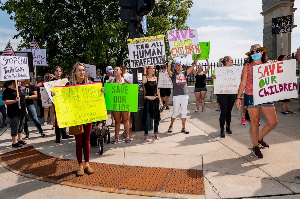 PHOTO: People march during a "Save the Children" rally outside the Capitol building on Aug. 22, 2020 in St Paul, Minn.