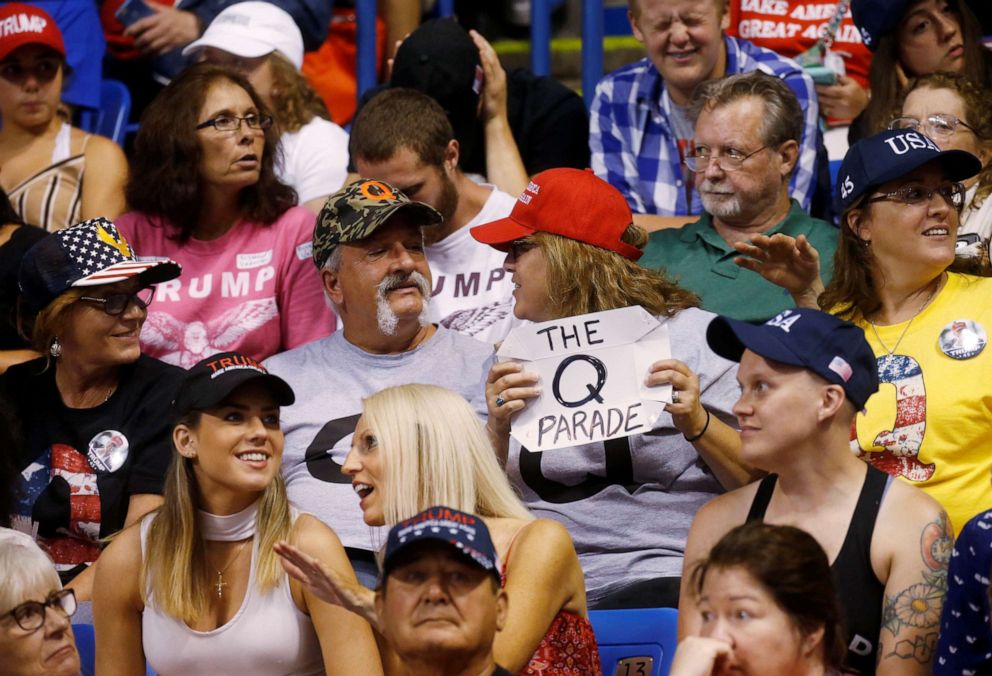 PHOTO: A supporter holds a QAnon sign as President Donald Trump addresses a campaign rally at Mohegan Sun Arena in Wilkes-Barre, Pa., on Aug. 2, 2018.