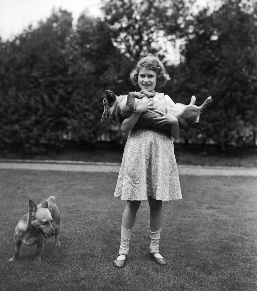 PHOTO: Princess Elizabeth with two Pembroke Welsh corgi dogs, Dookie and Jane, at her home at 145 Piccadilly, London, in July 1936.