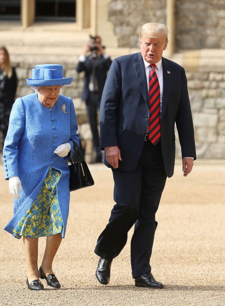 PHOTO: Queen Elizabeth II and President Donald Trump inspect an honour guard at Windsor Castle, July 13, 2018 in Windsor, England.