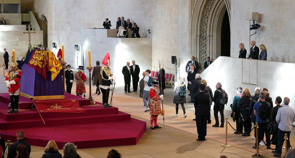 PHOTO: President Joe Biden and First Lady Jill Biden (at right on platform) pay their respects as they view the coffin of Queen Elizabeth II, as it Lies in State inside Westminster Hall, at the Palace of Westminster in London on Sept. 18, 2022.