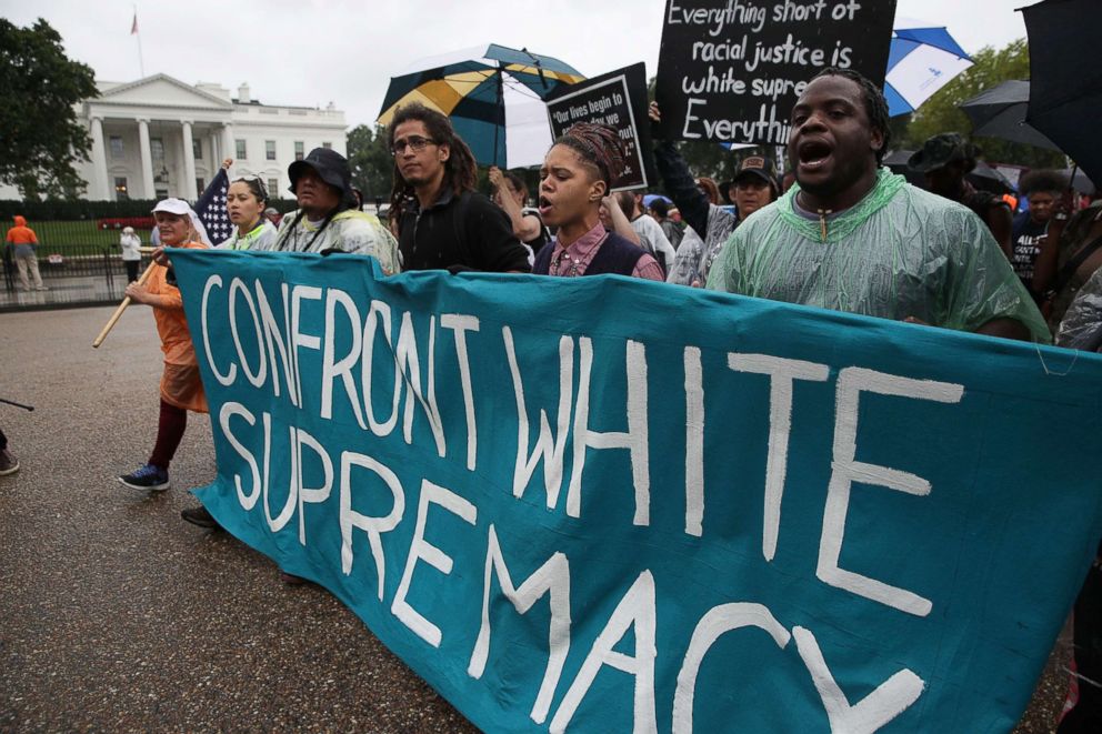 PHOTO: Marchers pass the White House after completing the 118-mile long journey from Charlottesville to Washington, D.C., calling for the dismantling of white supremacy, Sept. 6, 2017. 